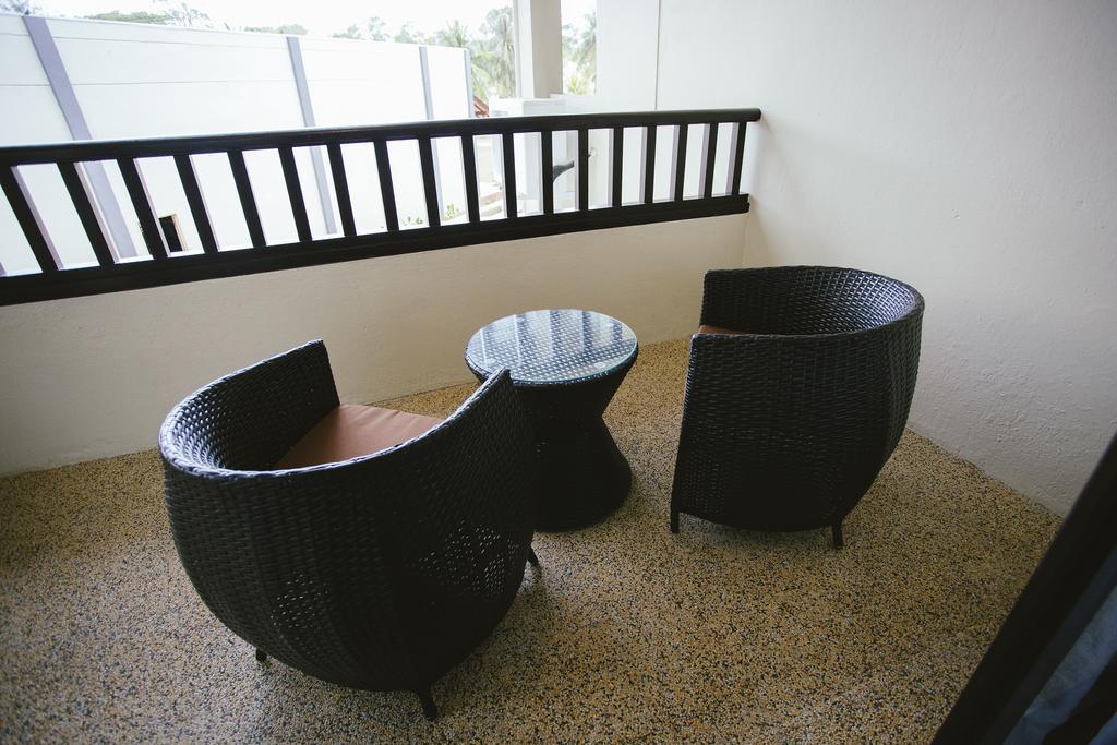 Sand & Sandals Desaru Beach Resort & Spa Exterior photo A set of outdoor furniture